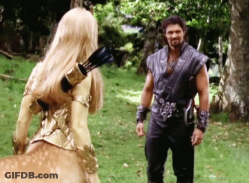 Man And Centaur In Grassy Field GIF