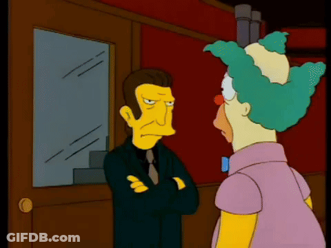 Man And Clown Standing In Front Of Window GIF