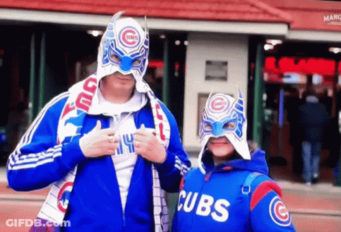 Man And Girl In Cubs Jackets And Masks GIF