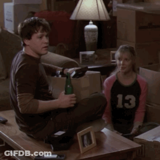 Man And Girl Sitting On Couch, Girl In Number 13 Shirt GIF