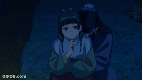 Man And Girl Sitting On Grass At Night GIF