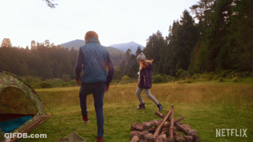 Man And Girl Walking In Field GIF
