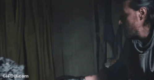 Man And Leopard Staring In Dark GIF