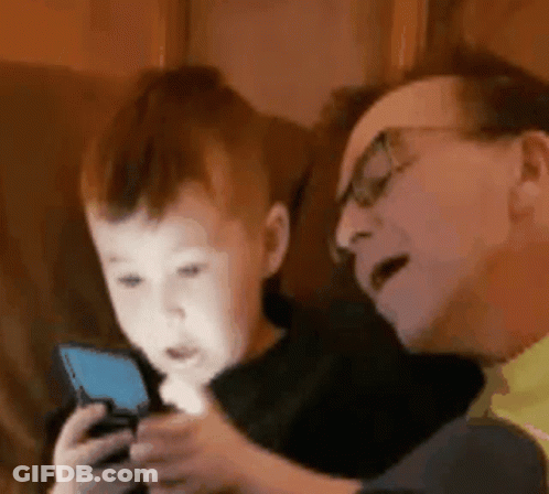 Man And Little Boy Playing With Cell Phone GIF