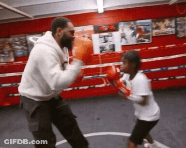 Man And Little Girl Boxing In Ring GIF
