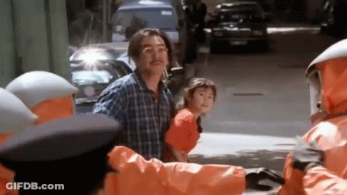 Man And Little Girl Walking Past Orange Jacket Group GIF
