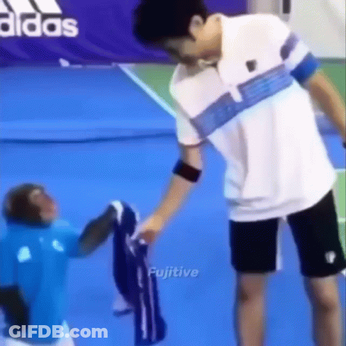 Man And Monkey On Tennis Court GIF