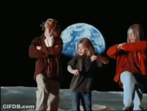 Man And Two Girls Dancing On Moon In Front Of Blue Planet GIF