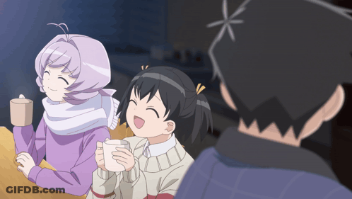 Man And Two Girls Sitting At Table Holding Cups GIF