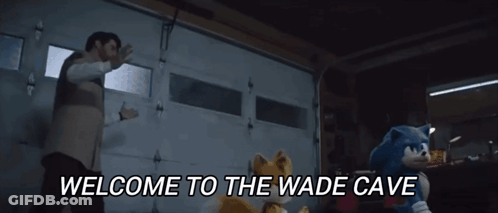 Man And Two Stuffed Animals In Garage Saying Welcome To The Wade Cave GIF