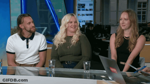 Man And Two Women At Table With Levis Laptop GIF