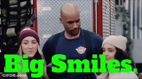Man And Two Women By Fire Truck Saying Big Smiles GIF