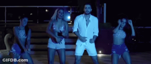 Man And Two Women Dancing In Dark Room GIF
