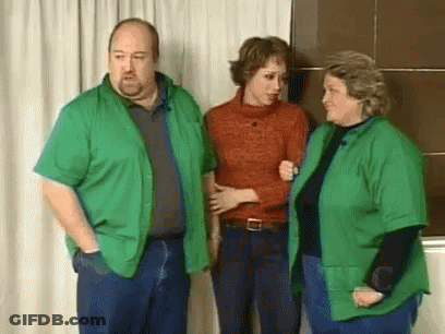Man And Two Women In Green Shirts GIF