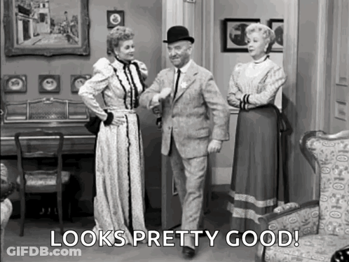 Man And Two Women In Living Room Looks Pretty Good GIF