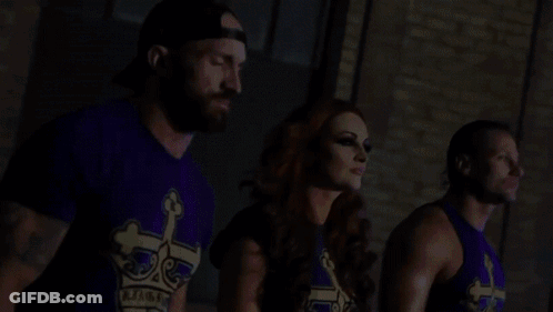 Man And Two Women In Purple Shirts With Crown Standing Together GIF
