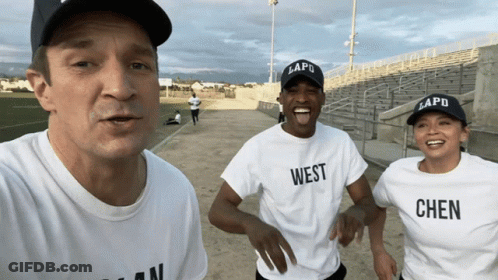 Man And Two Women In White T-Shirts Saying West GIF