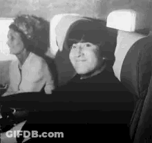 Man And Two Women On Plane Black And White GIF