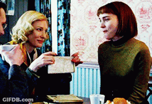 Man And Two Women Sitting At Table Having Conversation GIF