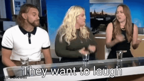 Man And Two Women Sitting At Table Saying They Want To Laugh GIF