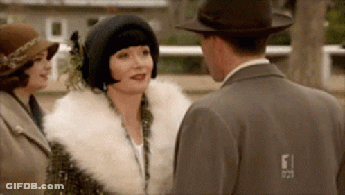 Man And Two Women Standing And Talking GIF