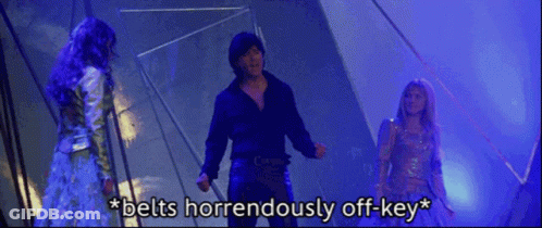 Man And Two Women Standing Belts Horrendously Off-Key GIF