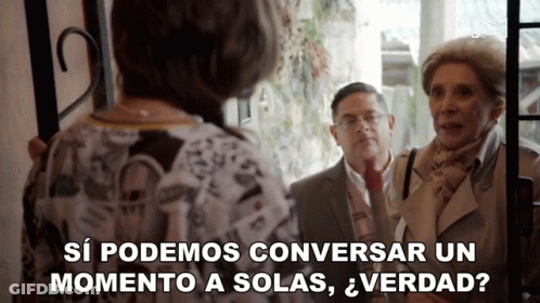Man And Two Women Standing In Front Of A Door Saying Si Podemos Conversar Un Momento A Solas Verdad GIF