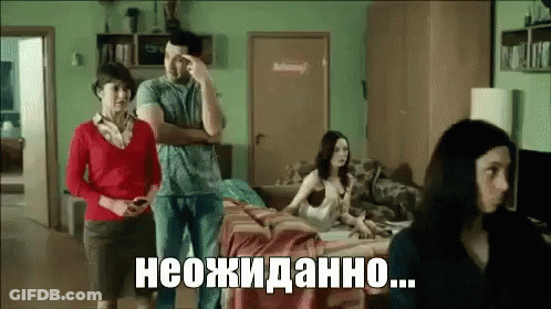 Man And Two Women Standing In Living Room With Woman On Couch GIF