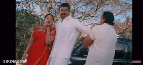 Man And Two Women Standing Next To Car GIF
