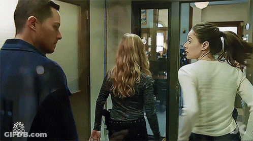 Man And Two Women Standing Next To Each Other GIF