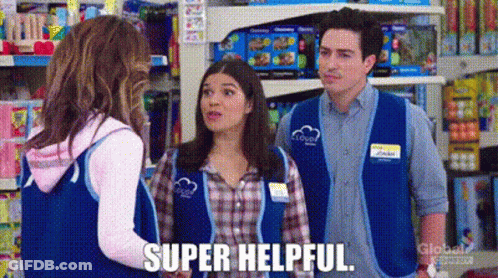 Man And Two Women Talking In Store GIF