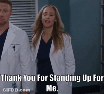 Man And Woman Applauding Before Crowd GIF