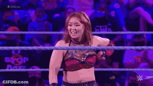 Man And Woman Arm Wrestling In Crowd With Number 4 GIF