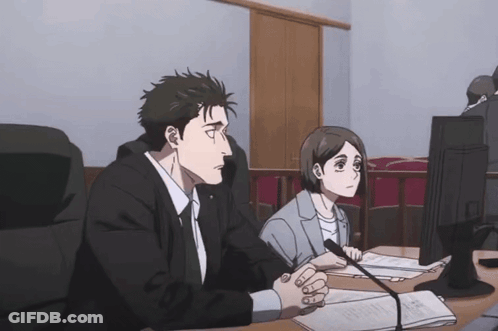 Man And Woman At Desk Looking At Computer GIF