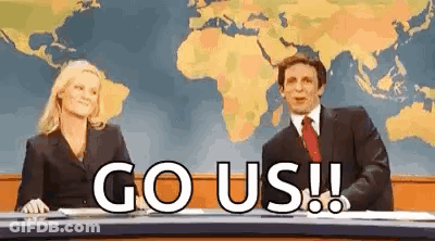 Man And Woman At Desk Saying Go Us GIF