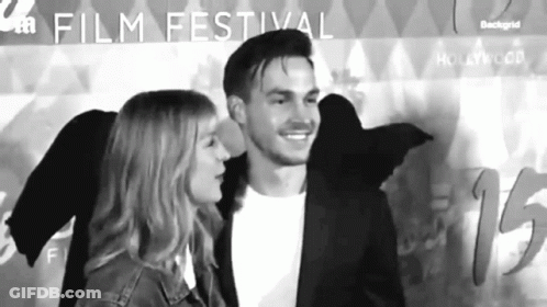 Man And Woman At Film Festival GIF