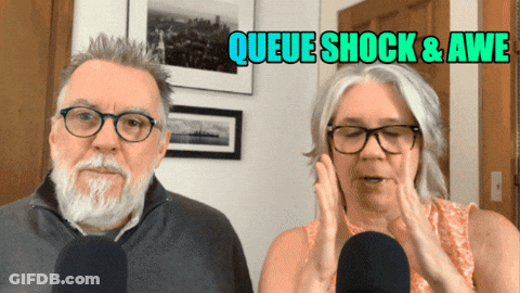 Man And Woman At Microphones Queue Shock & Awe GIF