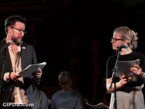 Man And Woman At Microphones With 60 Pin GIF