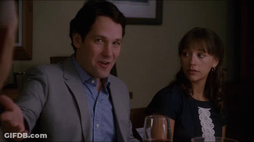 Man And Woman At Table Who Invited The Stand Up Comedian Over Here GIF