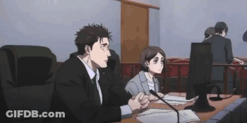 Man And Woman At Table With Microphone GIF