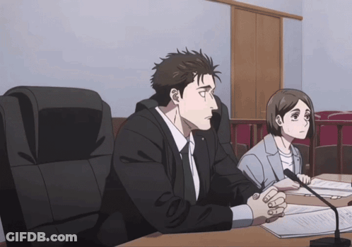 Man And Woman At Table With Papers And Microphone GIF