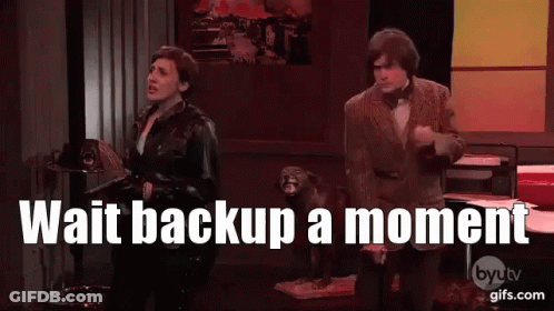 Man And Woman Beside Dog Saying Wait Backup A Moment GIF