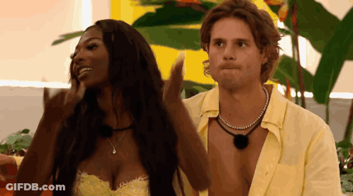 Man And Woman Beside Plant GIF
