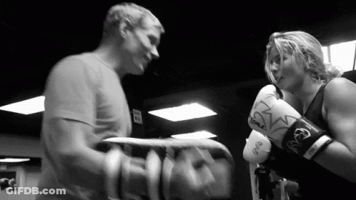 Man And Woman Boxing In Gym With Everlast Gloves GIF