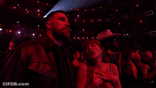 Man And Woman Clapping Before Crowd GIF