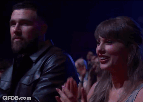 Man And Woman Clapping In Crowd GIF