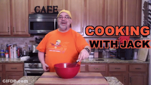 Man And Woman Cooking In Kitchen With Fire Dept Shirt GIF