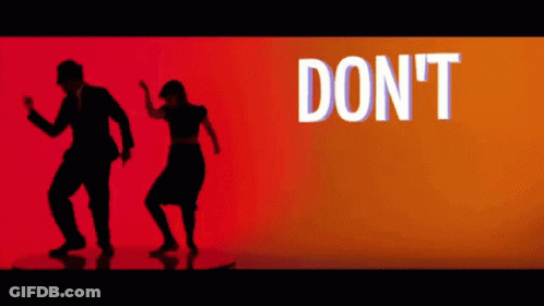 Man And Woman Dancing At Don't Sign GIF
