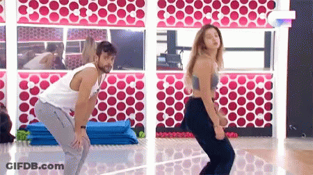 Man And Woman Dancing At Gym Mirror GIF