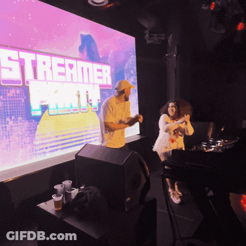 Man And Woman Dancing At Streamer Party GIF